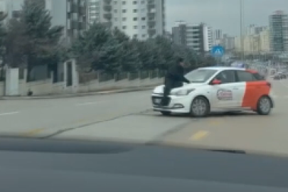 Tartışma sonrası aracın kaputunda metrelerce sürüklendi
